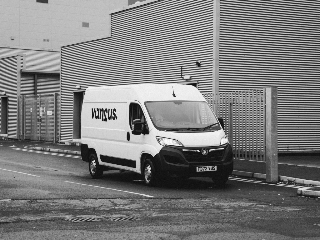 van2us van outside an industrial warehouse